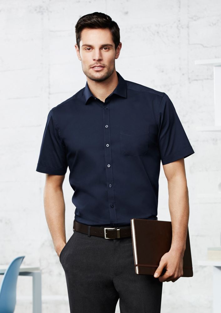 Teal short sleeve shirt for men, featuring a modern collar, chest pocket, and curved hem for a stylish, versatile look.