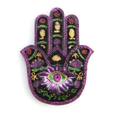 Hamsa-shaped incense burner (13cm) in metallic purple, green, and gold, designed for calming incense stick aromas.