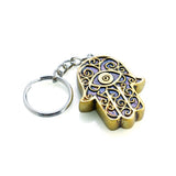Set of 6 hand-painted hamsa keychains with metallic finish, symbolizing protection and elegance for everyday use.