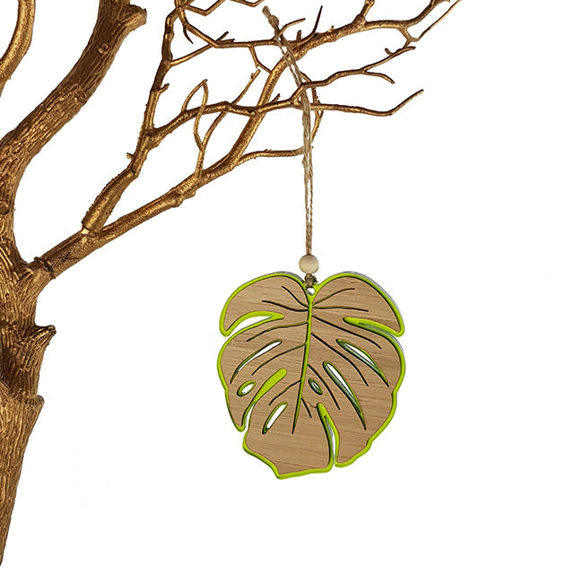 Lime green satin acrylic monstera ornament, 104mm, with laser-cut bamboo design; perfect hanging decor for plant lovers.