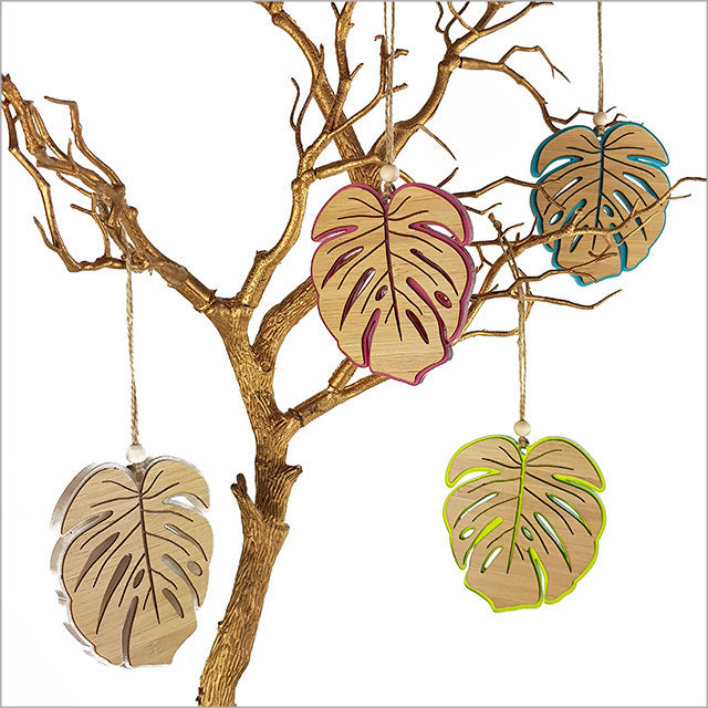 Pink satin monstera leaf ornament, 104mm, laser-cut bamboo, perfect for home decor and gifts, ready to hang.