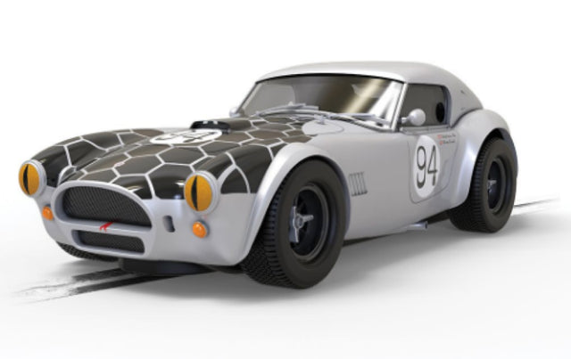 Shelby Cobra 289 Snake Eyes model featuring iconic design, snake motif, and F1 heritage, perfect for collectors and racing fans.