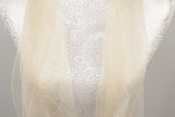 Luxurious cream 100% silk wrap, 180cm x 70cm with tassels, perfect for versatile styling and elegant comfort.