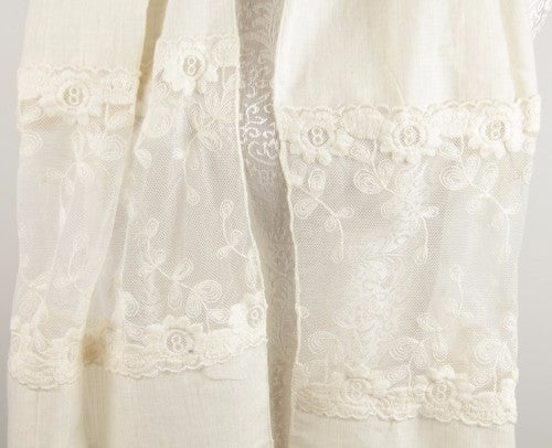 Ivory scarf showcasing intricate lace and botanical embroidery, perfect for elevating any outfit with elegance.