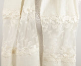 Ivory scarf showcasing intricate lace and botanical embroidery, perfect for elevating any outfit with elegance.