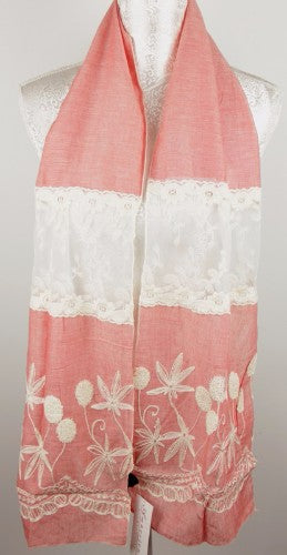 Delicate lace and floral embroidery define this elegant peach scarf, adding style and warmth for any occasion.