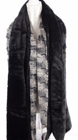 Elegant Raked Sands Shawl in coastal wave patterns, 72cm x 190cm, perfect for layering on breezy days or formal events.
