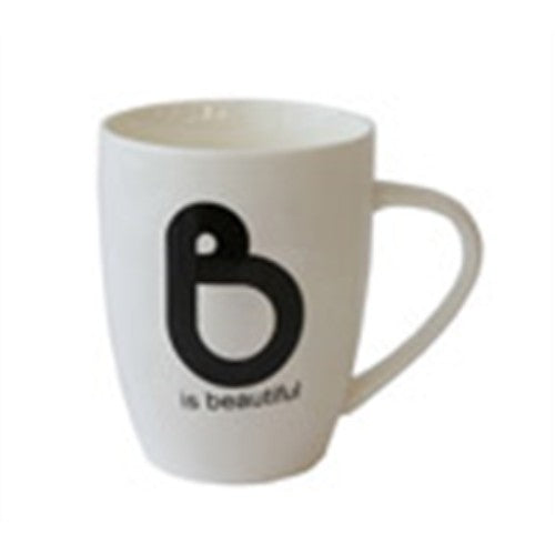 Black and white bone china mug with "B Is Beautiful" text, elegant design for daily beverages, dishwasher and microwave safe.