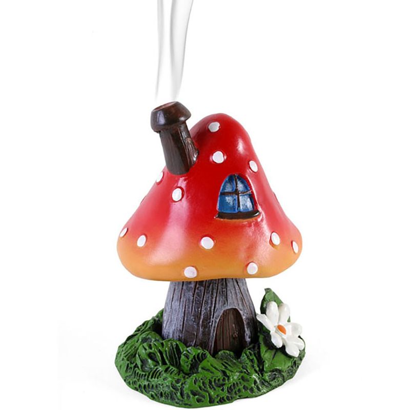 Bright red toadstool house incense cone holder by Lisa Parker, featuring intricate details and a captivating smoke display.