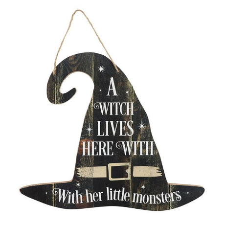 Hanging MDF sign that reads "A witch lives here with her little monsters," perfect for whimsical home decor or Halloween.