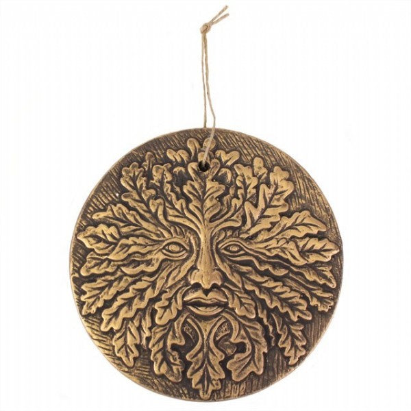 Circular terracotta Green Man plaque with copper effect finish, symbolizing nature and rebirth, featuring a twine loop for hanging.