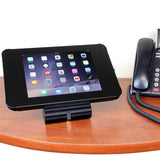 Lockable steel tablet stand for iPad, desk or wall mountable, secure enclosure with charging access for retail and education.