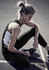 Stylish grey, black, and fluoro yellow ladies singlet with reflective trims, mesh panels, and a racer back for maximum comfort.