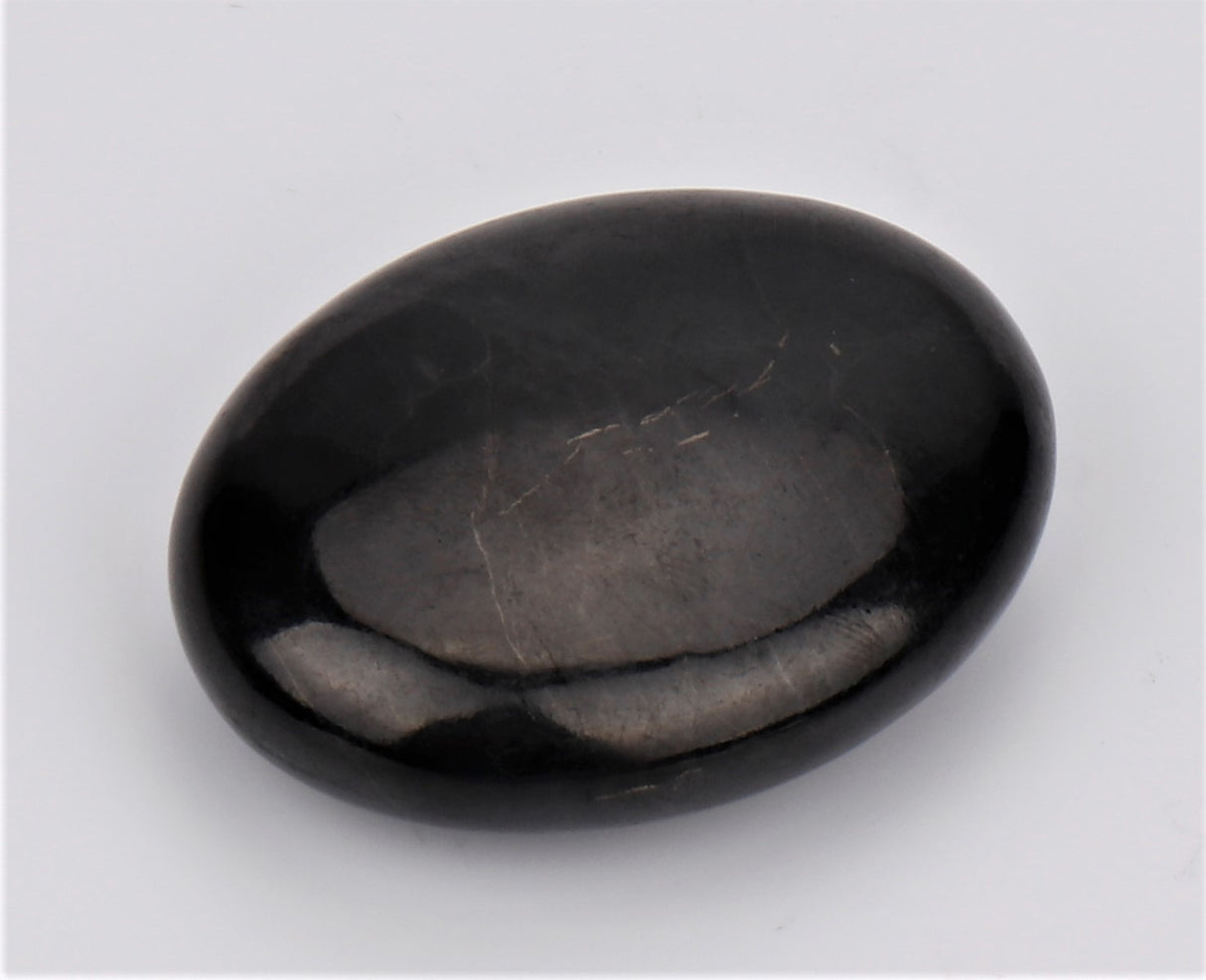 Shungite Flat Palm Stone, 5x4x1cm, absorbs EMF radiation, promotes wellness, and enhances energetic balance.