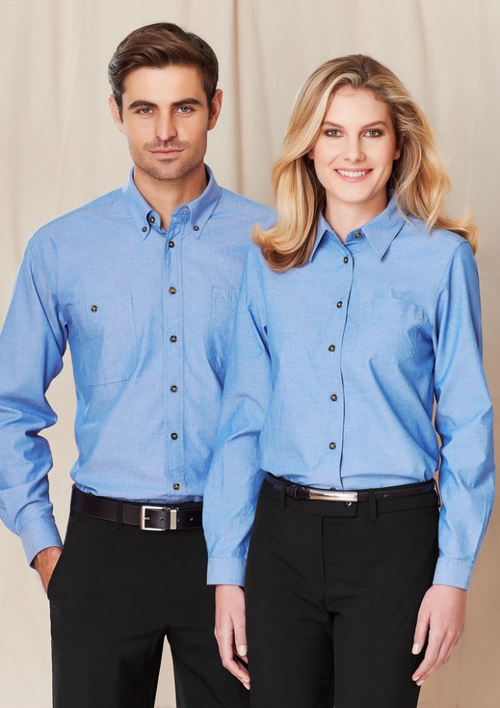 Ladies wrinkle-free chambray long sleeve shirt in blue, size 12, featuring relaxed fit, side splits, and chest pocket.