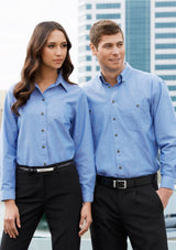 Men’s wrinkle-free chambray long sleeve shirt in blue with button-down collar, tortoise shell buttons, and practical chest pockets.