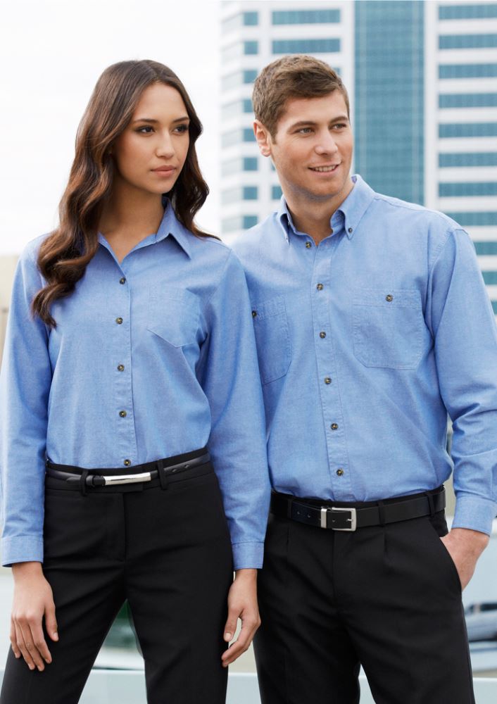 Ladies chambray long sleeve shirt in blue, size 12, features wrinkle-free cotton, relaxed fit, and stylish side splits.