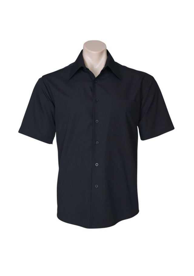 Black Men's Metro Short Sleeve Shirt (2XL) featuring a modern fit, curved hem, and practical chest pocket for casual or business wear.