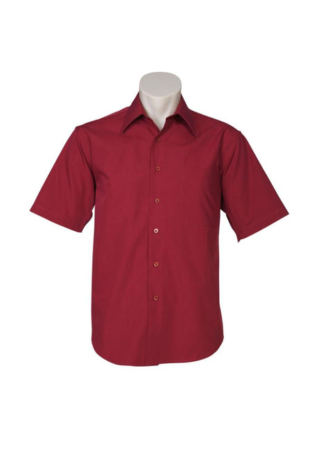 Men's cherry short sleeve shirt from Biz Collection, featuring a tapered fit, curved hem, and left chest pocket for stylish comfort.