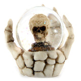 Set of 4 snow globes featuring skulls in skeleton hands, perfect for Halloween and gothic decor.