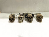 Colorful skull keychains in 4 assorted designs, perfect for keys or bags, each measuring 3 to 3.5 cm tall.