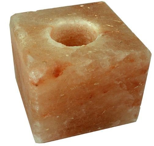 Himalayan salt cube tea light holder, emitting a warm glow, perfect for enhancing ambiance and decor in any space.