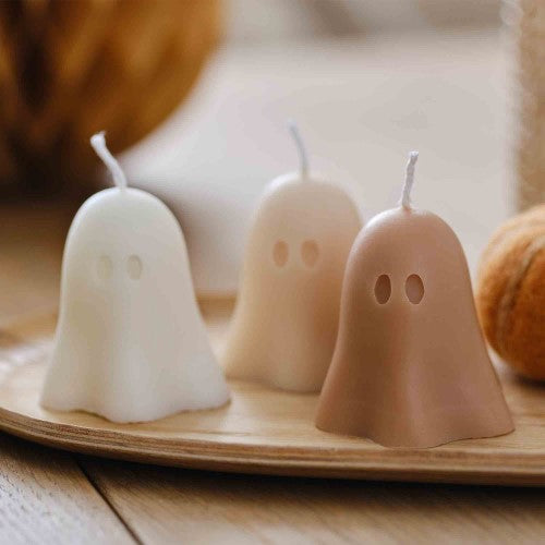 Three ghost-shaped unscented candles in pumpkin spice colors, perfect for Halloween and autumn decor.