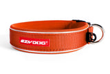 Vibrant orange EzyDog Neo dog collar for small breeds, featuring soft neoprene, quick-dry, and reflective piping for safety.