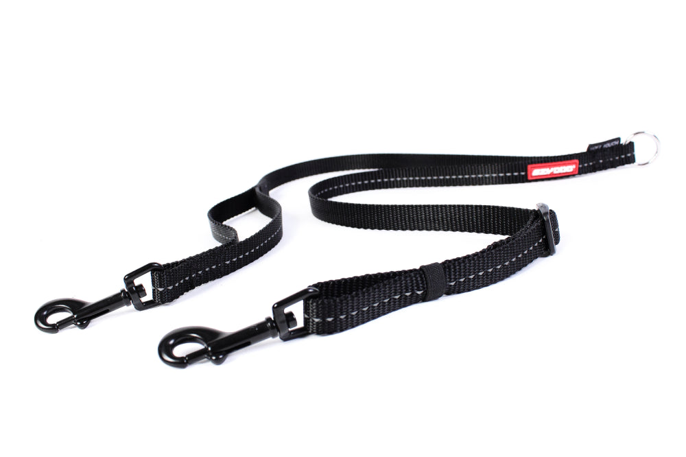 Soft padded black dog lead, 60cm long, designed for comfort and control, perfect for walking two dogs simultaneously.