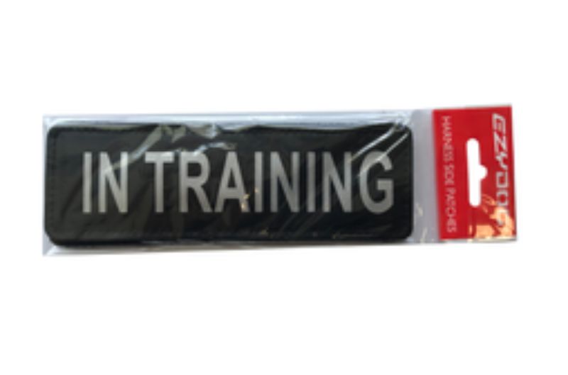 Large "IN TRAINING" side patch for dog harnesses, enhances visibility and safety during training sessions.