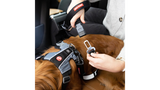 Innovative 52cm dog leash that easily converts seat belts into safe leashes, featuring a padded handle and accessory holder.