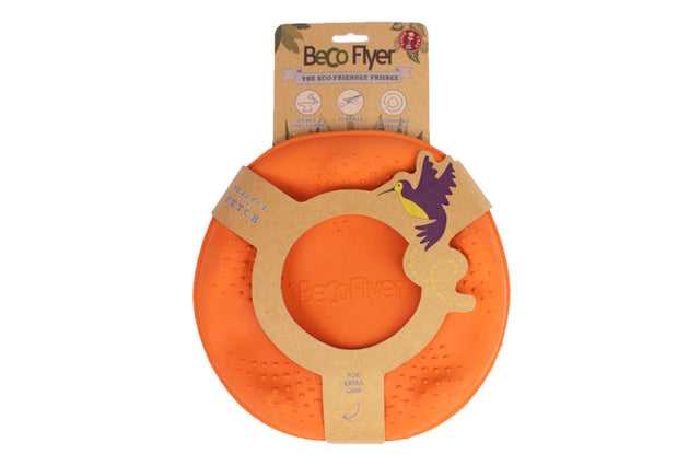 Bright orange BecoFlyer dog toy, eco-friendly flying disc made from natural rubber and rice husk, perfect for outdoor fetching.