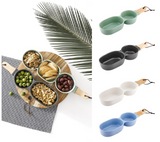 Modern charcoal serving bowl and stick set for stylishly displaying snacks and appetizers, crafted in porcelain and rubberwood.