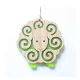 Whimsical lime sheep ornament made from bamboo and satin acrylic, perfect for holiday decor or thoughtful gifts.