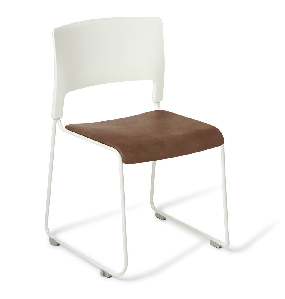 Slim white chair with Eastwood Tan upholstery, featuring sturdy sled frame and high-stacking design for modern spaces.