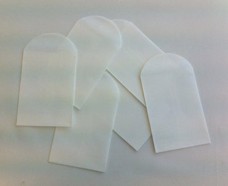 Small white craft bags in a 6-pack, ideal for wedding favors, organization, and DIY projects, measuring 12.5 x 7cm.