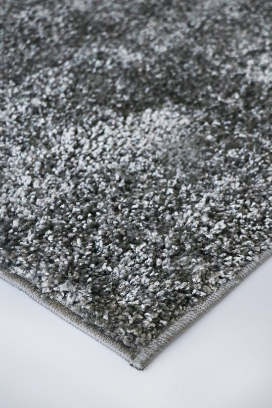 Plush Stirling Titanium floor rug in neutral tones, 230cm long, with a 30mm pile for comfort and style in any room.