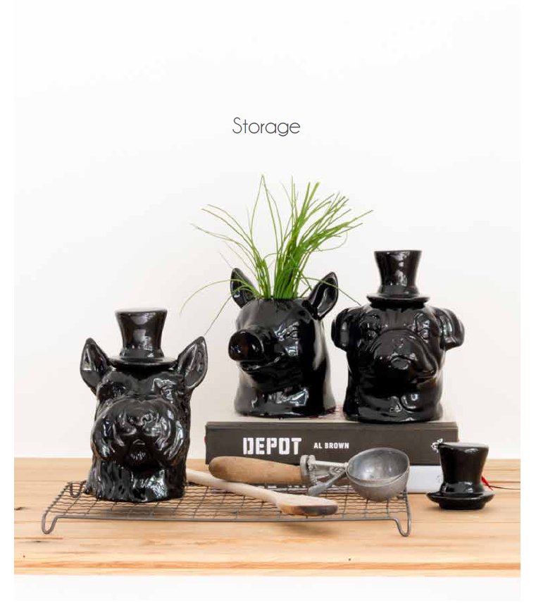 Black ceramic storage jar shaped like a Scottie pig, perfect for organizing items in the kitchen or home.