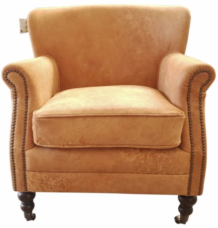 Rustic Mortimer Bigger Leather Armchair in Distressed Camel, featuring top grain leather, solid timber frame, and brass nail detailing.