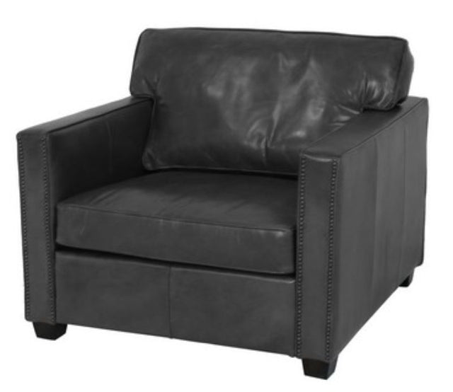 Stylish black armchair with plush cushioning, perfect for modern spaces, offering comfort and elegance for any room.