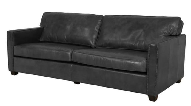 Sleek black 3-seater sofa with plush cushions, perfect for modern living spaces and entertaining guests.