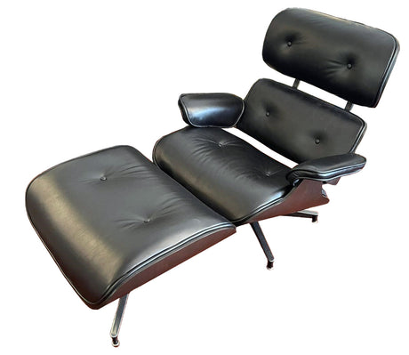 Eames Style Chair & Stool in Belon Black, featuring sleek curves, leather upholstery, and modern mid-century design.