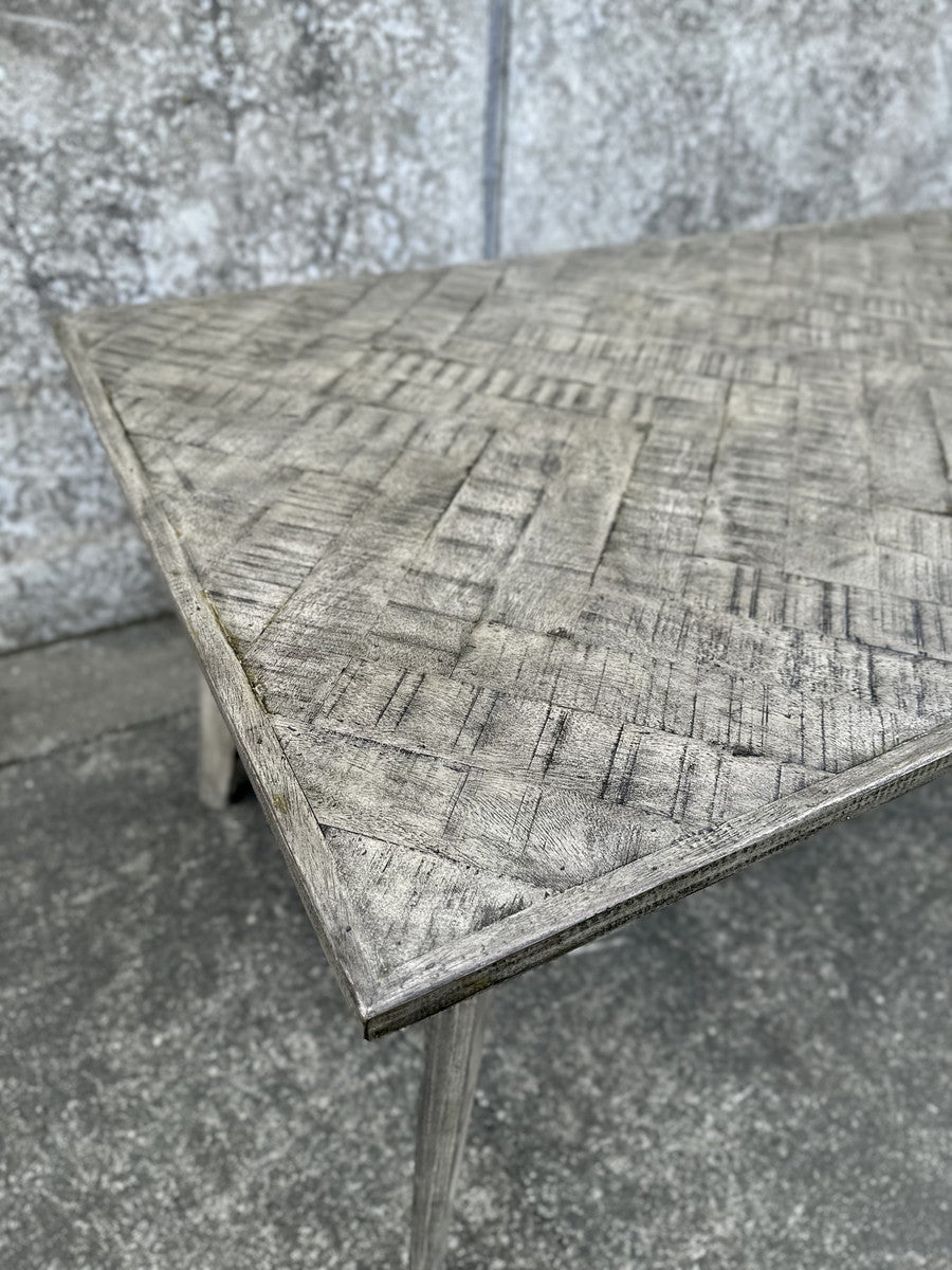 Elegant grey dining table with herringbone pattern, reclaimed mango wood legs, measuring 180cm for stylish gatherings.