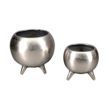 Silver aluminum pot on three legs, combining durability with a modern design, perfect for indoor plants and elegant decor.