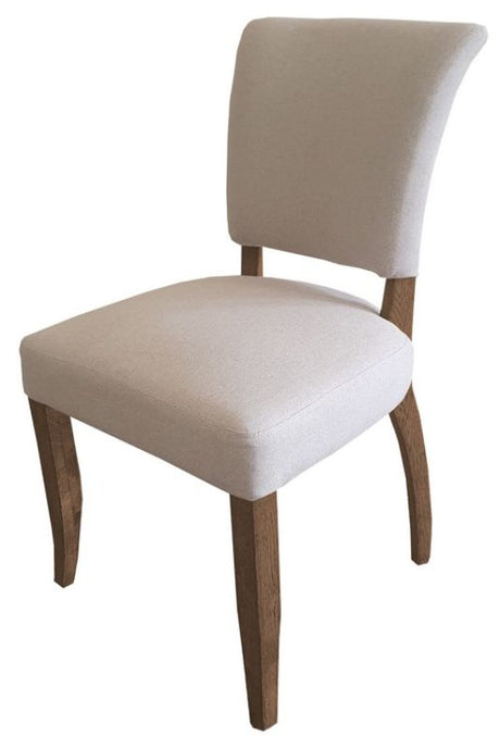 Elegant dining chair with natural linen upholstery, oak legs, and brass studs, blending rustic charm with modern sophistication.