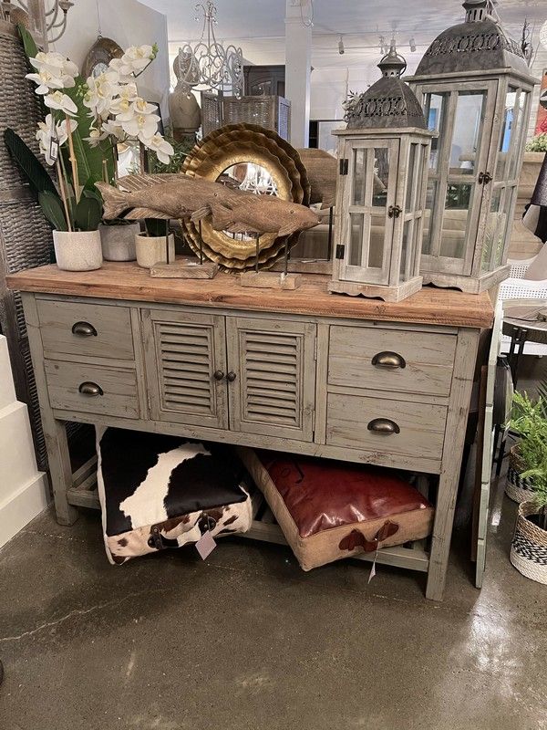 Stylish grey console with natural oak top, featuring 3 drawers and 4 doors for versatile storage and decor.