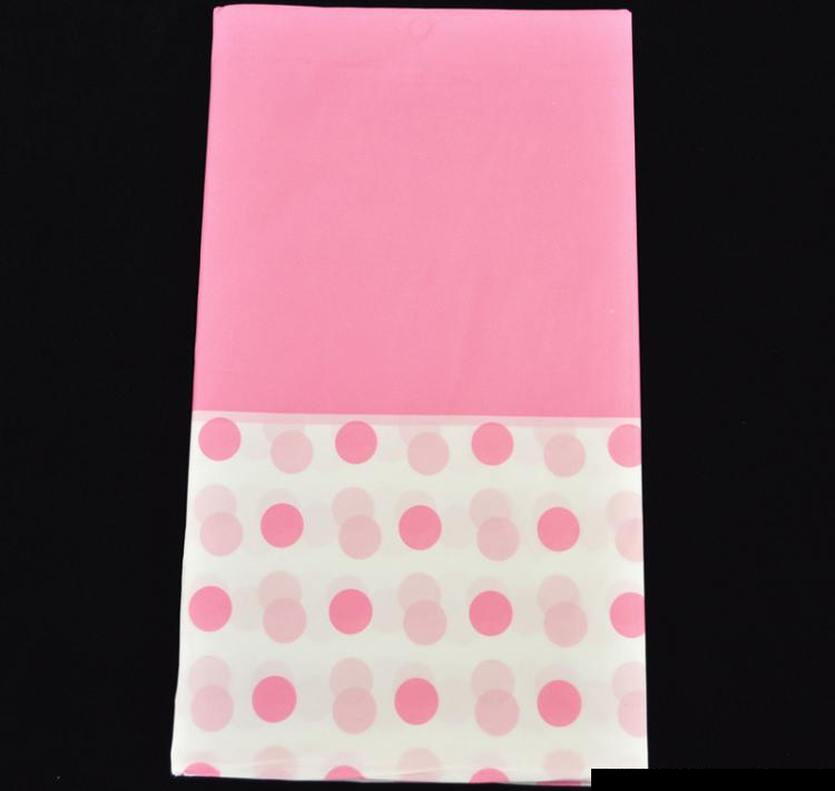 Light pink plastic table cover with a dot pattern, 137 x 274 cm, perfect for events and easy to clean.
