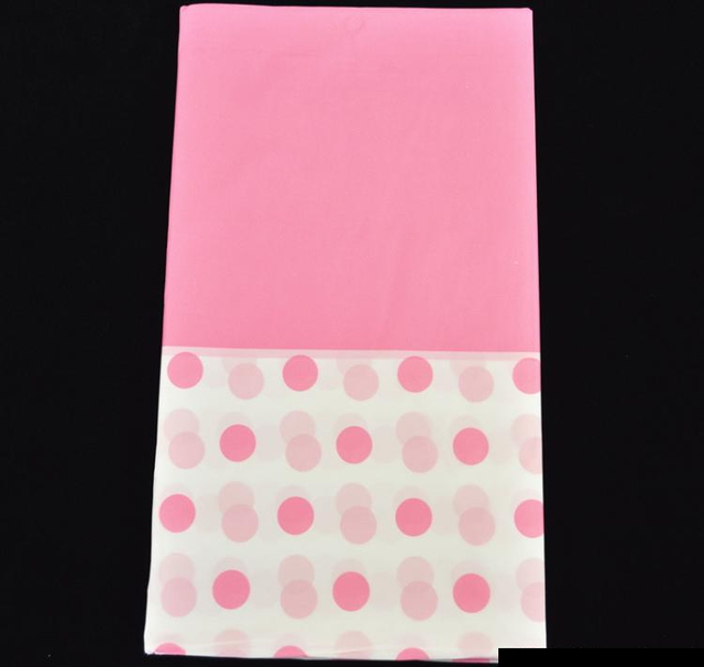 Light pink plastic table cover with a dot pattern, 137 x 274 cm, perfect for events and easy to clean.