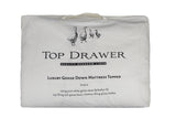 Double mattress topper made of 75/25 goose down and feather fill for enhanced comfort and support, fits 137 x 203 cm.