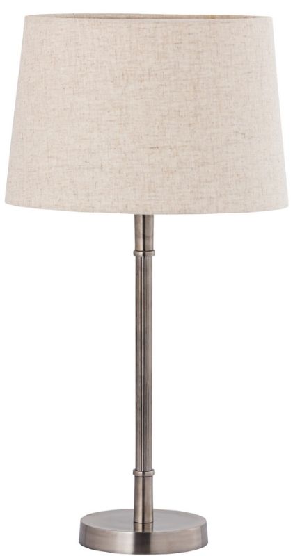 Elegant silver antique table lamp with a natural linen shade, perfect for cozy illumination in any modern decor.